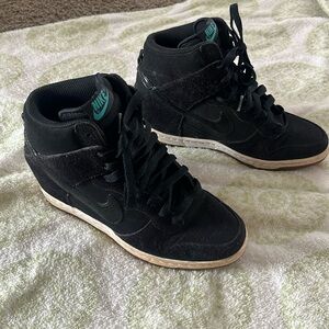 Black high top wedge Nike sneakers